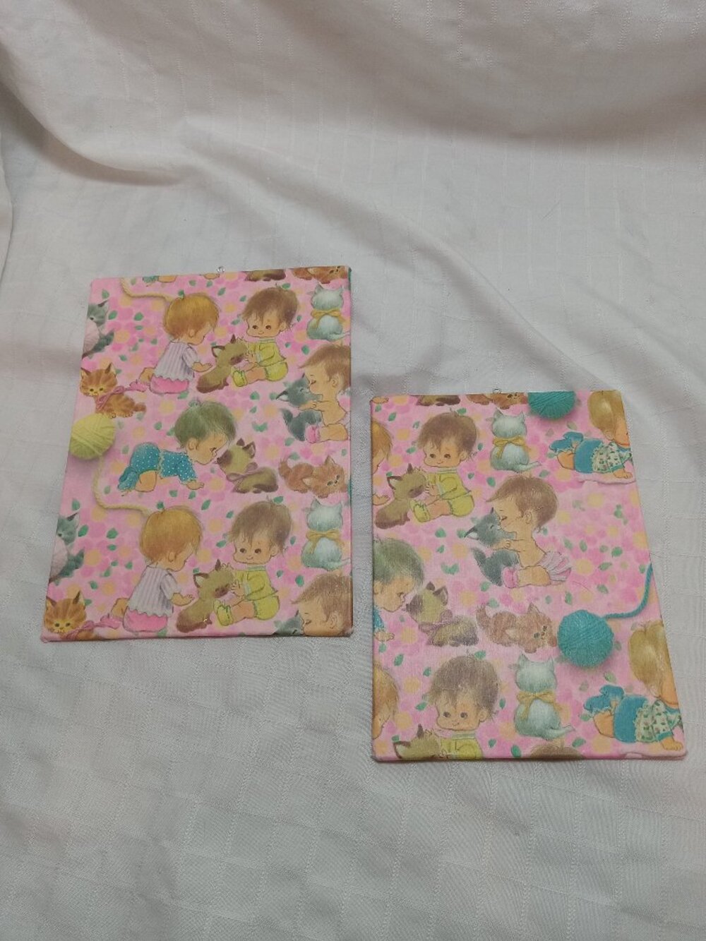 A set of handmade canvas for a baby's room, made of thin vintage wrapping paper